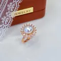 Detailed macro view of an elegant sunburst pearl ring featuring rose gold adjustable band - Adjustable Open / Sunflower Rose Gold Style / White