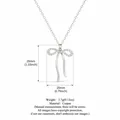 Elegant silver bow pendant necklace for women with sparkling white crystal accents - Tassel Bowknot / Silver Necklace