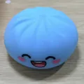 Blue steamed bun shaped squishy stress relief toy featuring a cute black smiley face design - Smiley Face / OPP Bag / Blue
