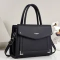 Close-up of a black square PU leather handbag with a textured finish and top handle. - Contrast Color Square Style / Black