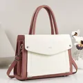 Detail view of two-tone pink and white PU leather square handbag with top handle - Contrast Color Square Style / Pink