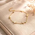 Elegante goudvergulde vlinder bedelarmband met fonkelende zirkonia details - Vlinder Zirkonia / Goud
