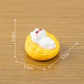 Cute miniature lazy kitten figurine with red sunglasses on a yellow sofa ornament - Yellow Cushion Cat / Yellow