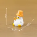 Miniature white duck figurine with orange hat and dimensions 2.7cm x 1.9cm - Relaxing Duck / Flower Pot Duck