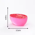 Miniature pink glow-in-the-dark half-cut watermelon resin ornament size 3.5cm x 1.6cm - Cherry Tomato