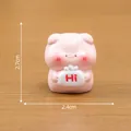 Mini pink pig figurine holding a 'Hi' bag for DIY dollhouse decoration, 2.7cm tall. - Holding Sign Pig / 2.4cm x 2.7cm