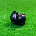 Miniature Halloween black cat figurine with red eyes, sized 2.4cm by 1.8cm for DIY decor - Devil Cat
