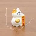 Cute miniature white and orange lucky cat figurine holding gold ingot with 2.7cm height - Prosperity Cat