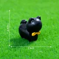 Small miniature black cat figurine with a yellow bow tie for DIY crafts and home decor - Vampire Cat