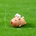 Mini Capybara figurine with bunny ears on green grass showing 1.9cm by 2.7cm size - 1.9x2.7cm / Bunny Ear Capybara Style