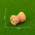 Miniature resin hay bale tied with red rope for garden decor, size 2.2x1.3cm - Hay Roll