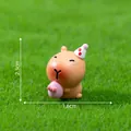 Cute miniature Capybara resin figurine holding pink Easter egg for desktop garden decor - Pink Easter Egg