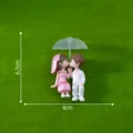 Cute miniature kissing couple figurine with green umbrella for wedding cake and DIY decor - Couple With Umbrella / White Suit Pink Dress Couple