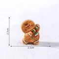 Christmas miniature dancing gingerbread man figurine with size markings 2.1cm by 2.7cm - Wearing Scarf / 2.7x2.1cm