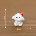 Cute miniature white puppy figurine wearing a red party hat with size markings 2.5cm by 2.4cm - Christmas Dog / Red Pointed Hat