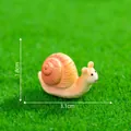 Miniature resin snail figurine for micro-landscape decor, 3.1cm long and 1.8cm high. - Snail