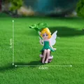 Miniature fairy garden figurine holding a green lotus leaf on a green grass background - Lotus Pixie (C3174) / 6.4x4.6cm / Green