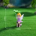 Detailed miniature fairy figurine holding a lotus leaf for micro landscape DIY garden decor - Lotus Pixie (C3174) / 6.4x4.6cm / Purple