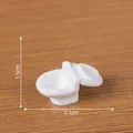 Modelo de inodoro en miniatura blanco con dimensiones 3,1 cm de largo y 1,5 cm de alto - Inodoro