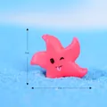 Petite figurine d'étoile de mer en résine rose avec visage mignon pour micro paysage - Étoile de Mer Espiègle / Magenta