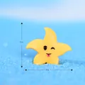 Étoile de mer jaune en résine pour micro-paysage avec dimensions de 2 cm affichées - Étoile de Mer Espiègle / Jaune