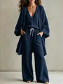 Detail showing the breathable textured fabric and relaxed fit of navy blue three-piece set - S / Top And Bottom / Navy Blue