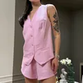 Detailed view of women's pink sleeveless pinstripe vest and matching casual shorts set - S / Top And Bottom / Pink