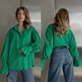 Front and back view of green long sleeve shirt with ruffled cuffs and collar detail - Green