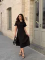 Full-length street style shot of an elegant black midi dress with flattering waistline - S / Dresses / Black