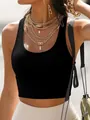 Black high-stretch ribbed yoga tank top for women shown on a model for casual style - XS / Tops / Black
