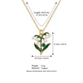 Elegant enamel lily of the valley necklace with gold chain and green stone pendant. - May Lily