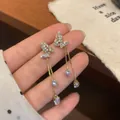 Elegant gold-finished butterfly tassel earrings decorated with sparkling crystals - Gold Zirconia Butterfly Tassel (Steel Post) (HDW023)