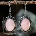 Vintage silver-tone filigree drop earrings with oval pink crystal stones and hook closure. - Rose Quartz