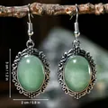 Vintage silver-tone hollow openwork drop earrings with oval green stone variant - Green Aventurine