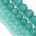 Close-up of peacock blue cat's eye stone beads for DIY jewelry making in various sizes - 4mm (Approx 90pcs) / Sea Blue Green