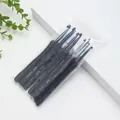 Macro detail of soft grip crochet hooks set in clear packaging for DIY knitting projects - 9-Piece OPP Bag Pack / Black