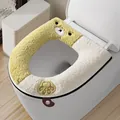 Soft plush toilet seat cover with cute yellow teddy bear and paw print design. - Green