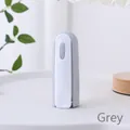 Portable mini lint roller featuring a creative flip cover design in minimalist grey color - Flip Cover Mini Lint Roller / Gray