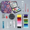 Comprehensive portable sewing kit with vibrant thread spools and colorful paisley zipper case. - Purple Bag with Magnifier / 86 Pieces Set / Purple