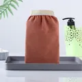 Exfoliating bath mitt in earthy brown color with a strong scrubbing coarse sand texture - Orange Red