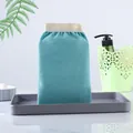 Teal thin exfoliating bath mitt with coarse texture for gentle body scrubbing at home - Blue