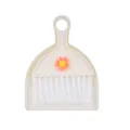 Mini desktop cleaning set featuring a small broom and dustpan with orange flower detail - Flower / Beige