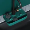 Detailed macro view of dark green silicone faucet drip mat with two steel scrubbers - Dark Green
