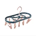 Multi-clip oval laundry drying rack with 12 clips in dark green and pink plastic. - Pink