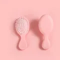 Mini cepillo de pelo rosa portátil con cojín de aire para un masaje suave del cuero cabelludo - Rosa