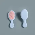 Mini cepillo de pelo portátil con cojín de aire en azul claro y rosa para el cuidado - Azul claro