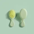 Simpatica mini spazzola per capelli con cuscino d'aria verde menta e setole massaggianti - Verde