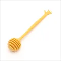 Yellow plastic honey stirrer stick with creative hand-shaped handle - Yellow