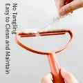 Portable manual lint remover tool with double-sided copper head for clothes and pet hair - Orange