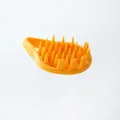 Portable orange silicone hair wash brush and scalp massager for dandruff relief - Orange